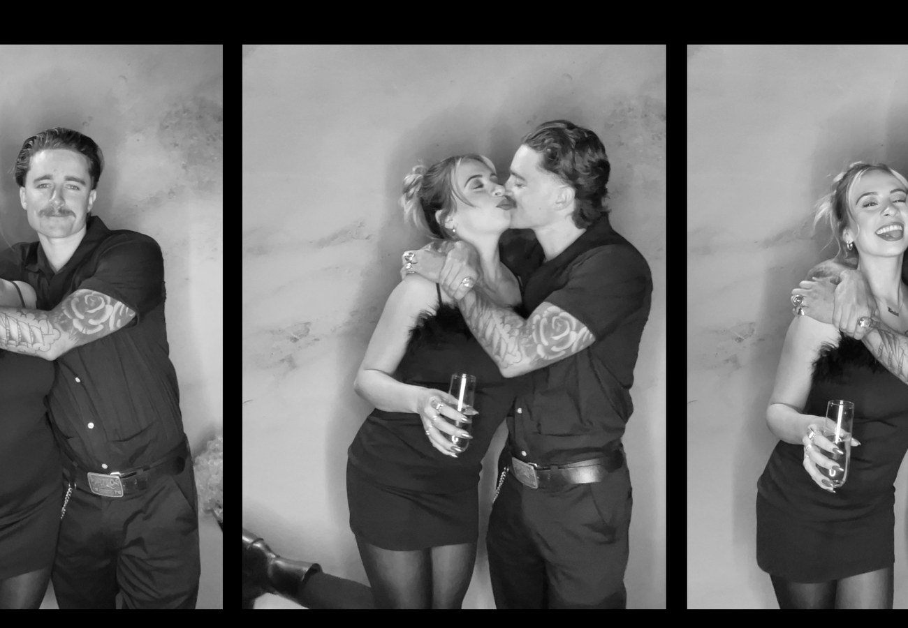 A black and white photo strip of three frames of a couple laughing together